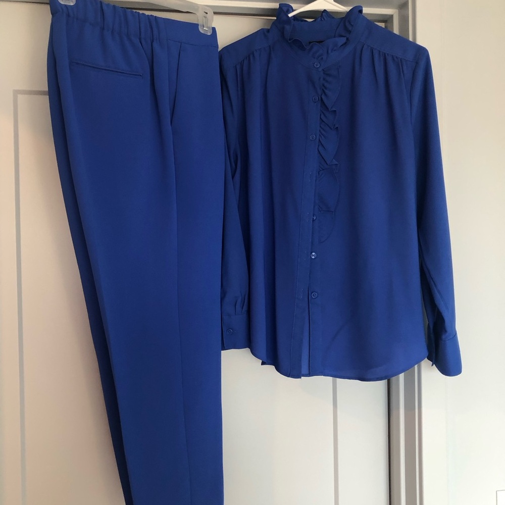 Royal blue blouse and pant set Ann Taylor sz L. Pants have pockets. Ruffle neck.